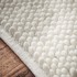 BIANCA Bijela kupaonska prostirka 50x120 cm Aspen Bobble